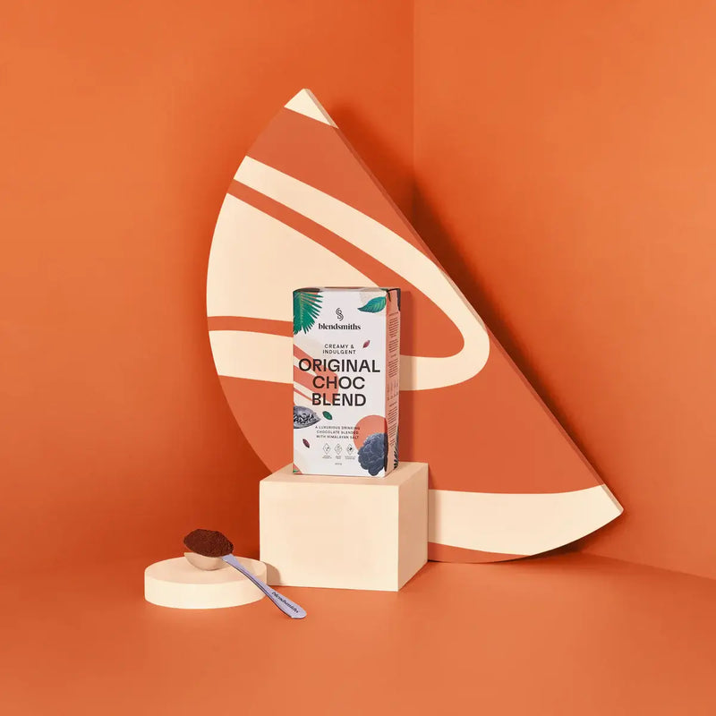 Blendsmiths Original Choc Blend packaging, featuring a creamy and indulgent drinking chocolate blended with Himalayan salt. The 250g box design incorporates warm earthy tones with abstract patterns and botanical elements, highlighting key attributes such 