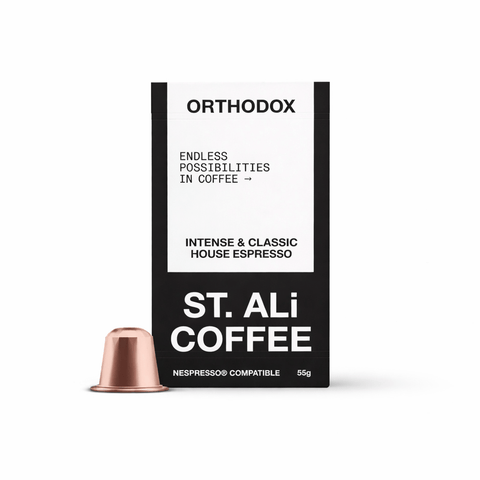 Orthodox | House Espresso Capsules packaging with a copper capsule beside it, showcasing premium coffee blend.