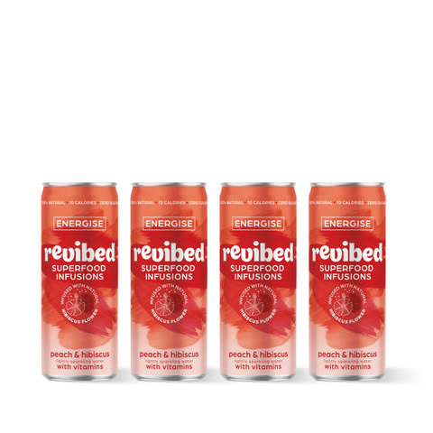 Revibed Hibiscus & Peach Superfood Infusion cans, four-pack, featuring a vibrant design highlighting peaches and hibiscus flowers with vitamins.