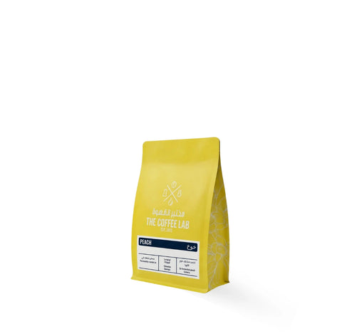 The Coffee Lab Peach Colombia Oporapa Caturra specialty coffee beans in yellow retail bag with peach co-fermented process.