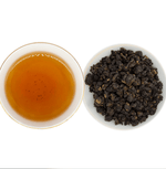 Clarity Master Amber Oolong tea from Alishan, Taiwan, with notes of spring honey, roasted wood, and maple-like sweetness, low in caffeine and sugar-free.