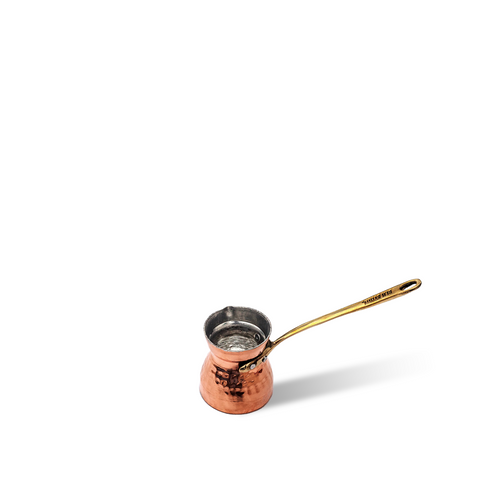 Ben Rahim Cezwe Coffee Pot, hand-formed in Tunisia from tin-lined copper, designed for smooth, rich Turkish coffee extraction with ergonomic handle for easy pouring.