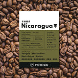 Nicaragua Premium Drip Bag Coffee packaging on coffee beans background, highlighting roast and tasting notes.