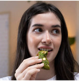 Emerald Matcha ceremonial-grade tea with vivid green color and smooth umami flavor, shown in a woman enjoying a matcha pastry