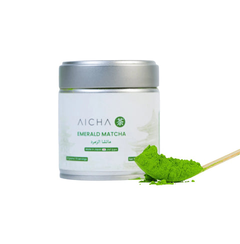 Emerald Matcha ceremonial-grade tea in a tin with vibrant green matcha powder and spoon