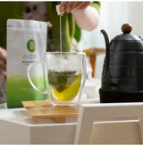 Premium Sencha Tea Bags brewed in a glass cup with Kyoto Uji tea, deep umami, and smooth taste