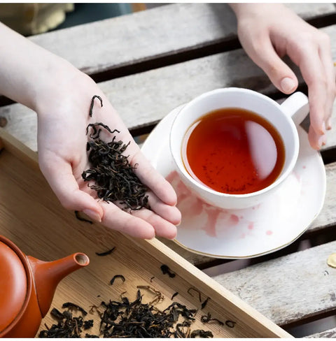 100 years old Wakōcha (Japanese Black Tea) loose leaves and brewed tea in a cup