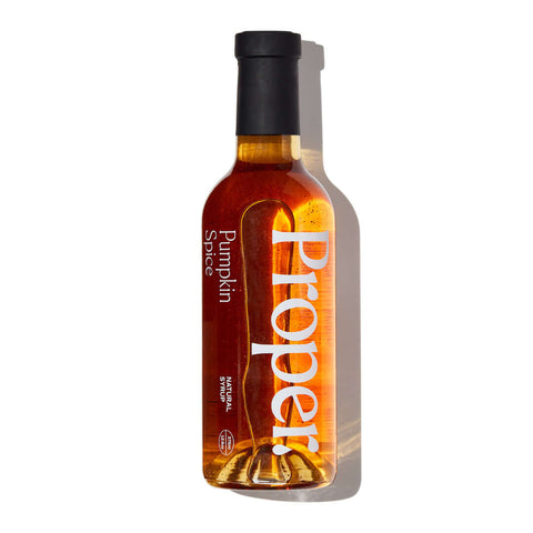 Proper Natural Pumpkin Spice Syrup bottle showcasing its gluten-free and vegan ingredients.