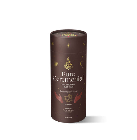 Pure Ceremonial cacao packaging with a rich brown design, featuring celestial gold details and spiritual hand illustrations.