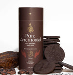Pure Ceremonial cacao packaging with a rich brown design, featuring celestial gold details and spiritual hand illustrations.