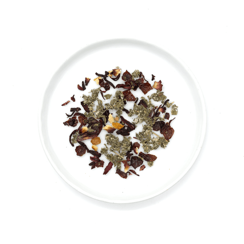 Tart pink herbal tea blend with hibiscus, rose hip, and raspberry leaf, offering a vibrant pink hue, floral aromas, and citrusy finish.