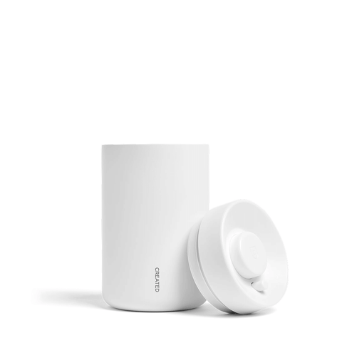 Reserve Vacuum Coffee Canister in sleek white design, preserving coffee freshness with vacuum-sealed technology.
