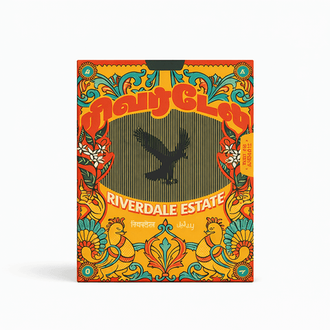 Colorful packaging of Riverdale Estate with decorative elements on a white background