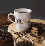 RL9 Coffee Espresso by Robert Lewandowski is a bold dark-roast blend of 100% Arabica beans, delivering thick crema and flavors of dark chocolate, cacao, walnuts, and tobacco.