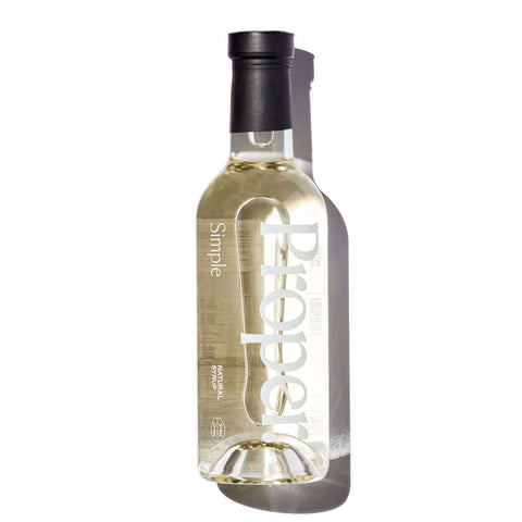 Bottle of Proper Simple Syrup showcasing natural ingredients and vegan-friendly label.