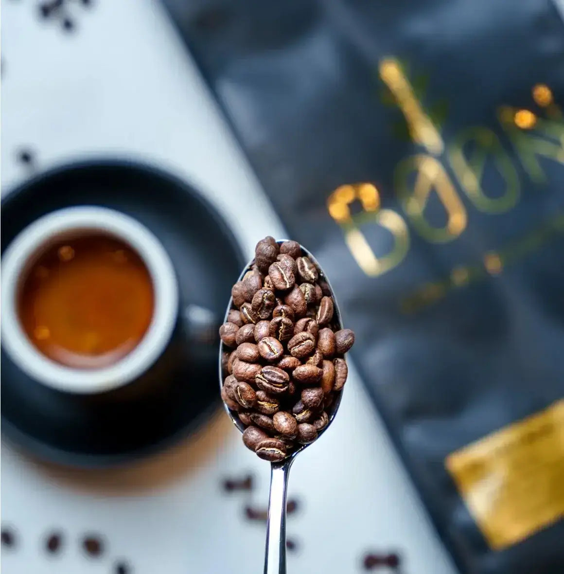 Premium Blend by Boon Coffee Roasters in sleek dark packaging, dark-roasted washed Arabica with bold, layered flavor and clarity, featuring a smooth body and lingering velvety chocolate finish.