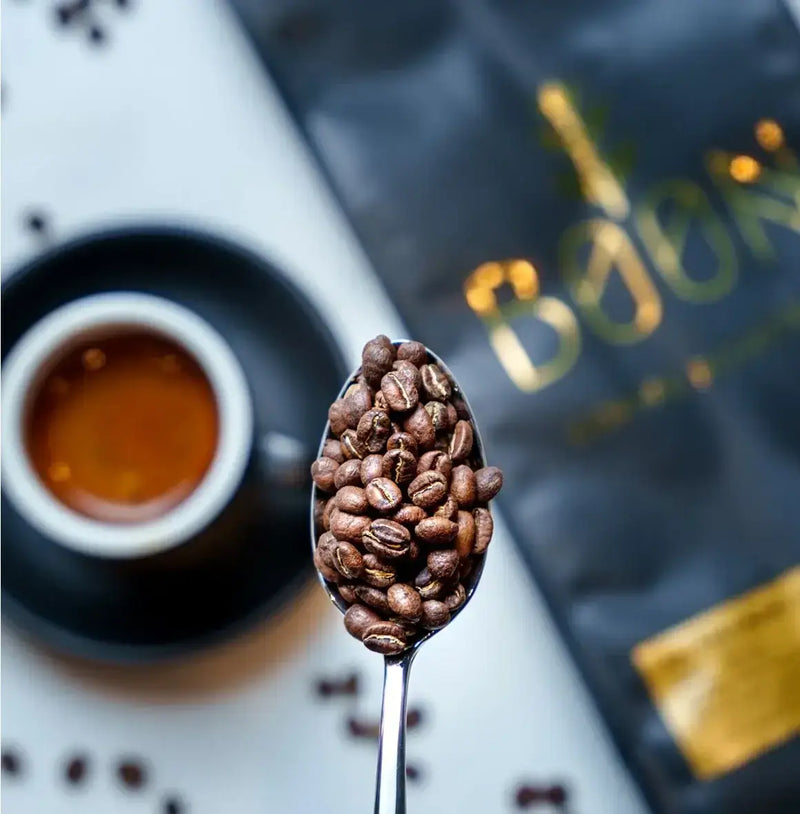 Premium Blend by Boon Coffee Roasters in sleek dark packaging, dark-roasted washed Arabica with bold, layered flavor and clarity, featuring a smooth body and lingering velvety chocolate finish.