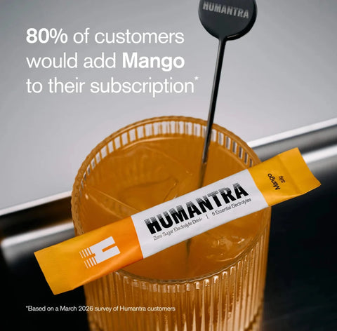 Humantra Mango Electrolyte Sachet Mix, in a glass