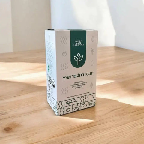 Traditional Yerba Mate packaging from Yerbanica on a wooden surface, showcasing its organic nature.