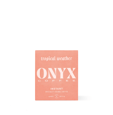 Tropical Weather Instant Specialty Coffee packaging in vibrant design, featuring Onyx Coffee brand.