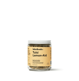 Jar of Tulsi Lemon-Aid herbal tea blend by Lake & Oak, featuring a caffeine-free, refreshing mix.
