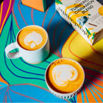 Blendsmiths Turmeric & Cinnamon Blend, featuring a warm and invigorating premium drink made with turmeric and spices. The 250g box design incorporates earthy yellow tones, botanical illustrations, and spice elements like cinnamon and star anise.