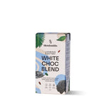 Blendsmiths White Choc Blend packaging, featuring a luxurious and buttery vegan white chocolate drink made with melted cocoa butter. The box has a sleek design with soft blue and earthy tones, abstract patterns, and botanical elements. 