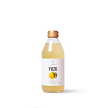 Bottle of Kimino Yuzu Sparkling Juice made with Shikoku yuzu and mountain spring water.